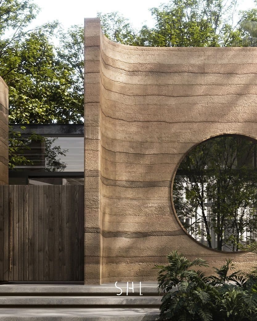 Rammed-earth monolith with circular gateway
